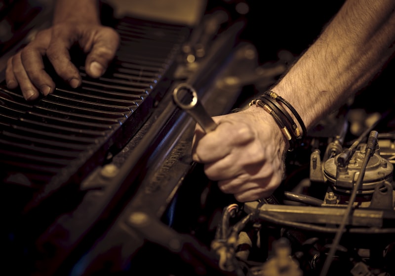 Close-up of a technician working on a diesel engine, the poster frame for the wash process video