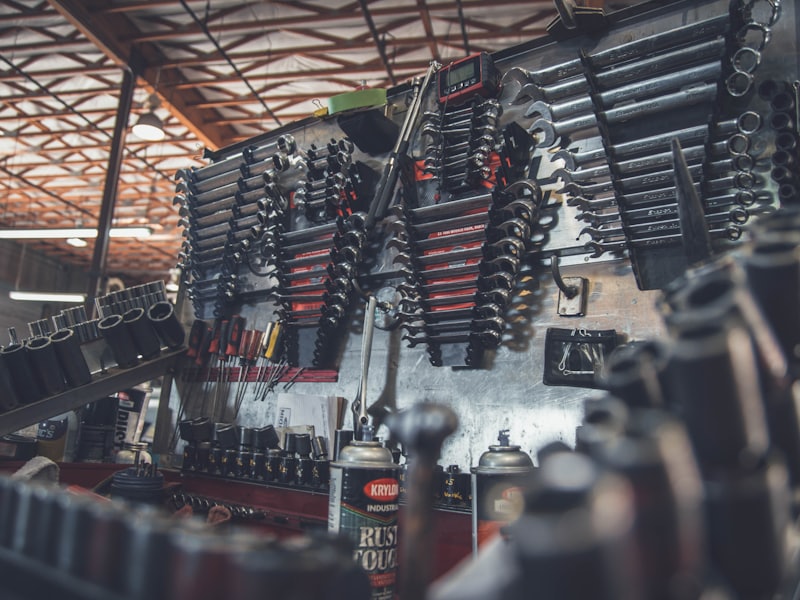 A wall of workshop tools above a busy bench